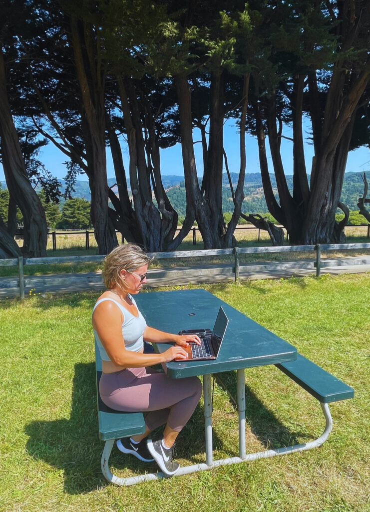 woman working at computer outside